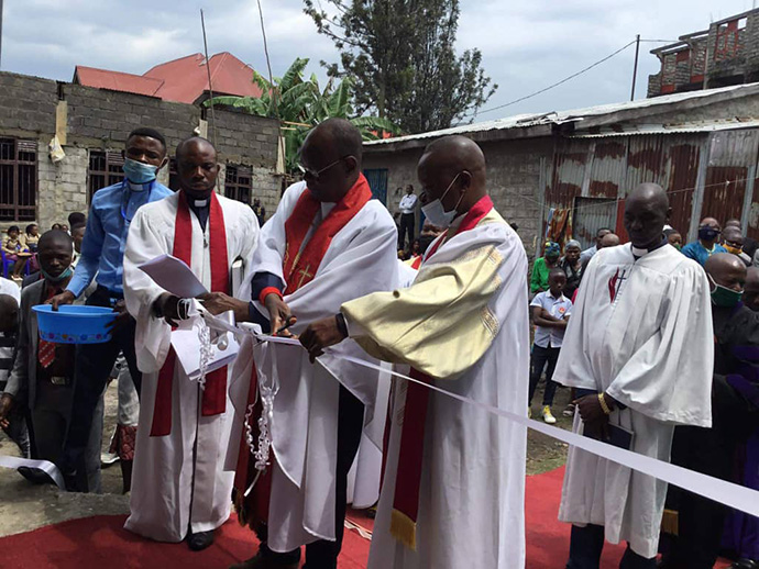 Bishop Gabriel Yemba Unda cuts the ribbon at the new Amani United Methodist Church in Goma, Congo, during a dedication in October. The modern church building can hold more than 1,000 people. Photo by Philippe Kituka Lolonga, UM News.