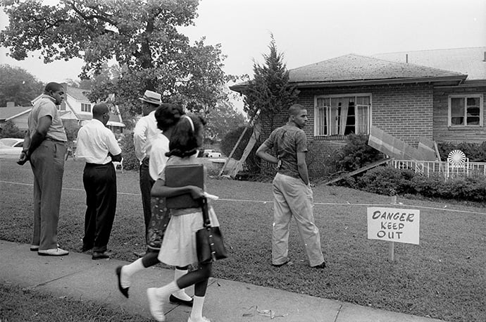 African Americans view the bomb-damaged home of Arthur Shores, an attorney for the NAACP, in Birmingham, Ala., in 1963. Photo by Marion S. Trikosko, U.S. News and World Report Magazine Photograph Collection/Library of Congress.