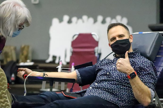 The Rev. Aaron Brown, pastor of Saint Paul’s United Methodist Church in Joplin, Missouri, makes a blood donation. Brown says he’s been sure to get exercise and continue consulting with a personal coach and spiritual director through this pandemic year. Photo courtesy of Saint Paul’s United Methodist Church. 