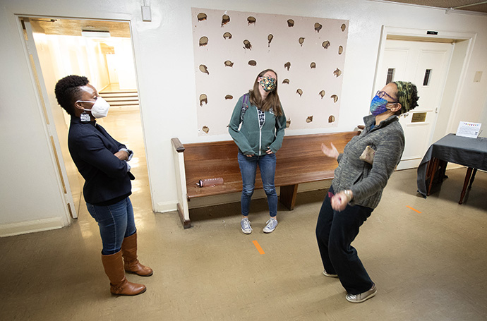 The Rev. Chenda Innis Lee (left) shares a light moment with church members Ashley Moore (center) and Tracy Jefferson at Fairlington United Methodist Church in Alexandria, Va. Photo by Mike DuBose, UM News.