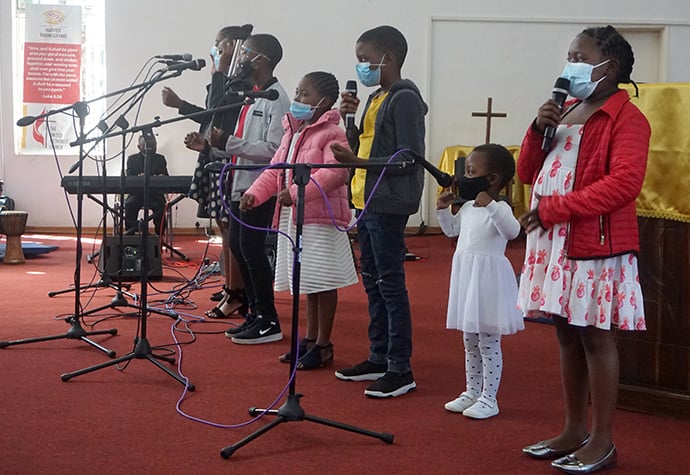 Nashe Chokera (second from right) sings with the Junior Church Sunday praise team at Chisipiti United Methodist Church in Harare. Photo by Kudzai Chingwe, UM News.