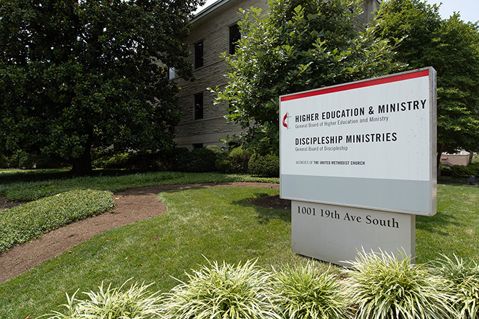 A sign outside the Kern Building shows that it has been home to both Discipleship Ministries and the United Methodist Board of Higher Education and Ministries. The two will continue to share office space in the Harry Denman Building across the street. Photo by Mike DuBose, UM News.