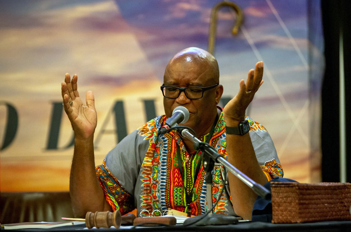 Bishop W. Earl Bledsoe prays during the Northwest Texas Annual Conference session. The bishop and other conference leaders stress that a resolution in favor of the conference leaving The United Methodist Church is aspirational and nonbinding. Photo courtesy of the Northwest Texas Conference. 