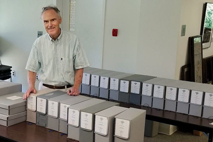 The Rev. Kenneth Rowe, shown here in the United Methodist archives at Drew University in Madison, N.J., was an author, professor, librarian, archivist and bibliographer. Rowe died Oct. 8, at age 84. File photo courtesy of the United Methodist Commission on Archives and History.