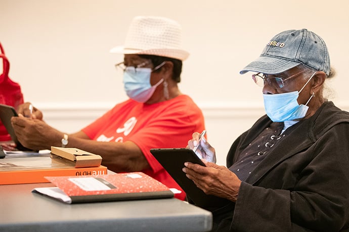 Dorothy Haley (left) and Joyce Long learn to use tablet computers during a training session for Project Connect. Photo by Mike DuBose, UM News.