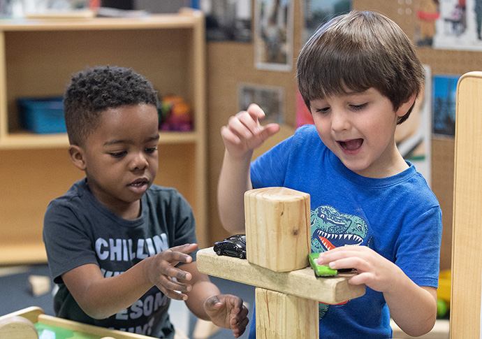 Daycare students Michael (left) and Aiden play together at Bethlehem Centers. Photo by Mike DuBose, UM News.