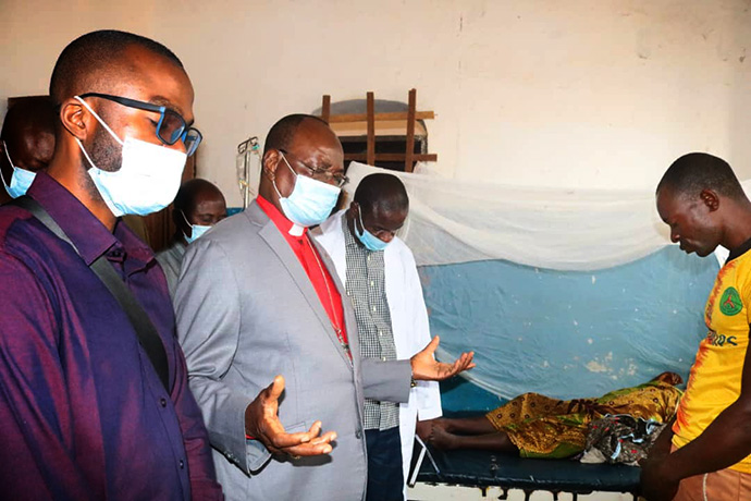 United Methodist Bishop Gabriel Yemba Unda prays for a sick person at Tunda General Hospital in Congo. The region is dealing with a monkeypox outbreak that has killed 28 people. Photo by Chadrack Londe, UM News.