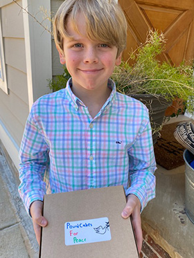 Smith Wilson, 9, has been selling pound cakes at his church, Senoia United Methodist in Senoia, Georgia, to raise money for UMCOR’s Ukraine relief work. Photo courtesy of the North Georgia Conference. 