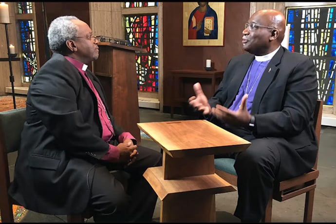 United Methodist Bishop Gregory Palmer (right) and The Episcopal Church’s presiding bishop, Michael Curry, discuss full communion between the two denominations in 2019. The proposed agreement is on hold for now after the postponement of the United Methodist General Conference to 2024. File screenshot from video courtesy of the Council of Bishops of The United Methodist Church.