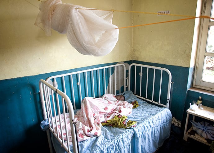 A child, who is sick with malaria, rests at the provincial hospital in Malanje, Angola, in 2006. A program to reduce malaria morbidity in East Angola was among projects funded this year by the Board of Global Ministries. File photo by Mike DuBose, UM News.