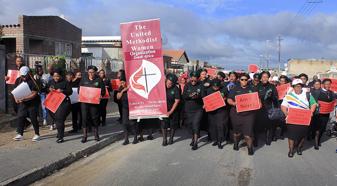 Members of the South Africa Conference’s women’s organization march against gender-based violence in Cape Town on Aug. 11.  The women worked in partnership with the Department of Sports, Arts and Culture of the South African government and were joined by members of the community. Photo by Tapiwa Bopoto, UM News.