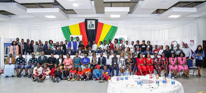 Twins Association of Zimbabwe presidents Tendai Mayor and Farai Lawyer Katonha pose for a photo with their wives, Yvette and Nvette, and some of the association's members at the International Twins Festival held in August. Photo courtesy of the Twins Association of Zimbabwe. Click here to enlarge image.