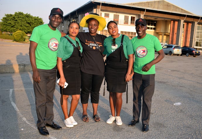 Tendai Mayor and Farai Lawyer Katonha with their wives, Yvette and Nvette, and Felistas Magora-Dube, who taught at one of the schools attended by the brothers. Magora-Dube said it has always been difficult to tell them apart and simply refers to them as "the Katonha twins." Photo by Eveline Chikwanah, UM News. 