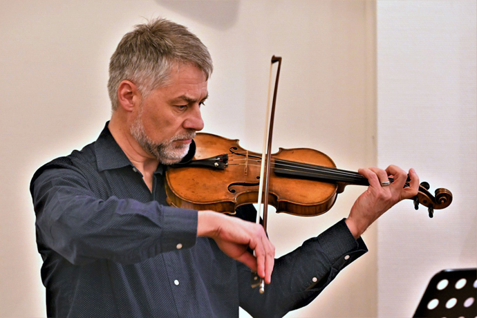 Newly elected Bishop Stefan Zürcher plays the violin during the meeting of the Standing Committee on Central Conference Matters. The committee deals with issues that affect The United Methodist Church’s regions in Africa, Europe and the Philippines. Zürcher is set to become bishop of the Central and Southern Europe Central Conference in August. Photo by Klaus Ulrich Ruof, Germany Central Conference.  