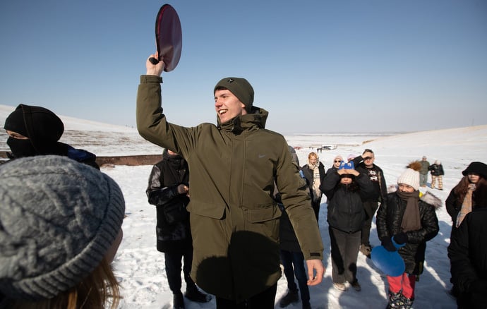 Alex Kutsov helps gather young people for an afternoon of sliding in the snowy Tian Shan mountains, an activity sponsored by Livespring United Methodist Church in Kara-Balta, Kyrgyzstan. Photo by Mike DuBose, UM News.