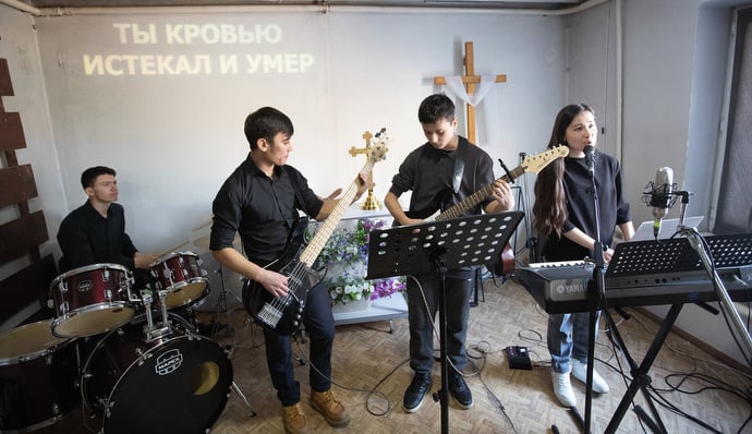 The praise band plays during worship at Livespring United Methodist Church in Kara-Balta, Kyrgyzstan. Photo by Mike DuBose, UM News.