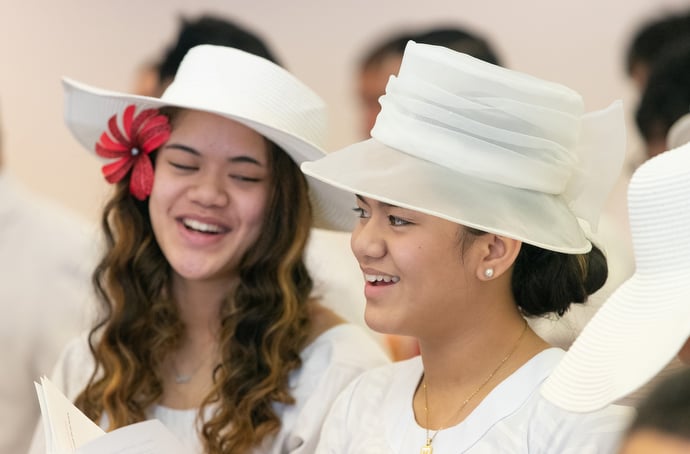 Sisters Faasulu and Maila To’omalatai sing during the chartering service. Photo by Mike DuBose, UM News.