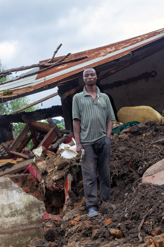 Petros Janga stands by his house, which was completely destroyed after Tropical Cyclone Freddy ravaged southern Malawi. Fortunately, Janga’s family is safe. Most of the United Methodist church buildings in the region also collapsed. Photo by Francis Nkhoma, UM News.