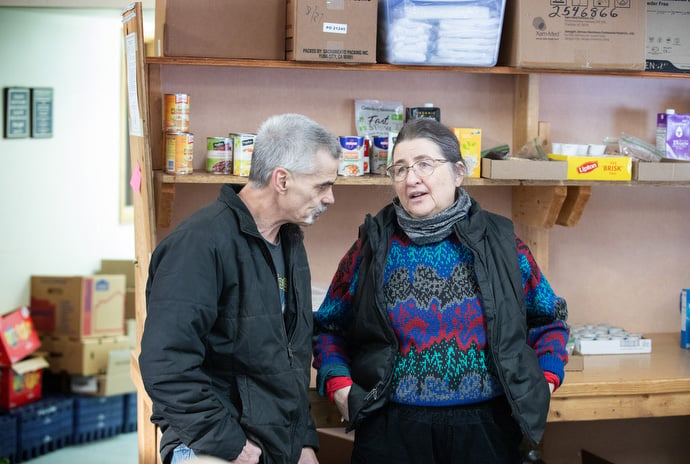 Jimmie Hutson visits with the Rev. Christina DowlingSoka at the Willow (Alaska) Community Food Pantry. DowlingSoka is the co-pastor of Willow United Methodist Church, which hosts the food pantry. She also serves as superintendent of the Alaska Conference. Photo by Mike DuBose, UM News. 