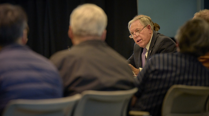  Retired United Methodist Bishop Alfred W. Gwinn reads final instructions to the jury before they begin deliberations on Sept. 21, the third day of a church trial of Bishop Minerva G. Carcaño in Glenview, Illinois. Gwinn is serving as the presiding officer, the equivalent of a judge, in the trial. Photo by Paul Jeffrey, UM News.