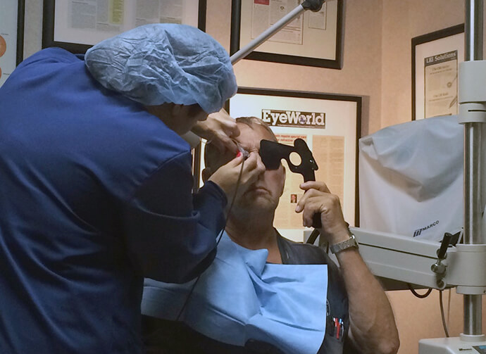 An optometrist examines a dementia patient brought for care by a volunteer with START Senior Solutions, based in Eden Prairie, Minn. The nonprofit trains family, friends and members of groups — particularly churches — to safely and comfortably serve as short-term companion visitors who can support primary caregivers. Photo courtesy of START Senior Solutions.