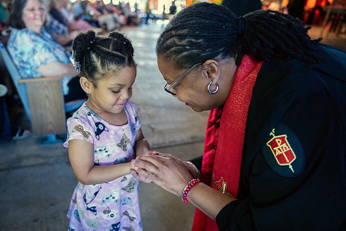 North Georgia Conference Robin Dease speaks with a child during the Southeastern Jurisdictional Conference July 12 in Lake Junaluska, N.C. Starting Sept. 1, she will lead both the North Georgia and South Georgia conferences. Photo by Derek Leek, courtesy of the Southeastern Jurisdiction.